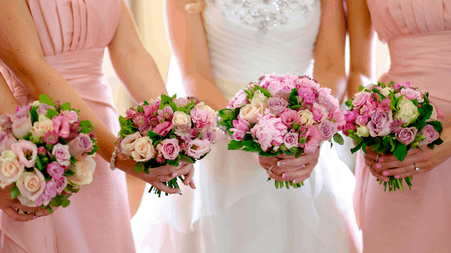 Etiquette For Bridesmaids: 24 Things You Should Know 1 Bridesmaids holding colorful floral bouquets.