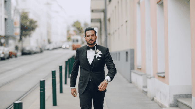 Wedding Planning For The Groom: The No-Stress Guide to Nailing Your Role! 4 Groom walking confidently down street.