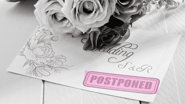 Wedding invitation with floral sketch and roses, pink POSTPONED stamp across the card.