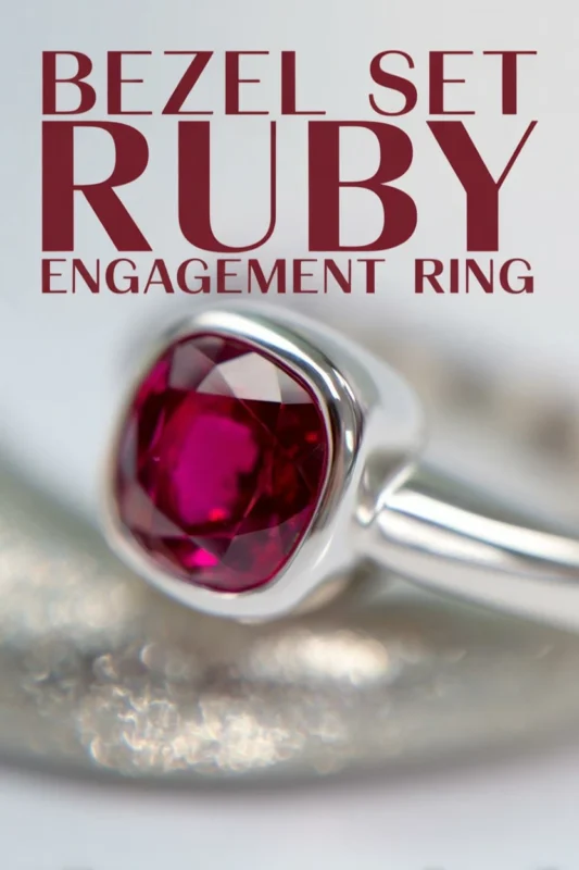 Non-Traditional Engagement Rings: Say Yes To A New Trend 8 Bezel set ruby engagement ring with deep red gemstone on a sleek silver band in a clean minimalist close up