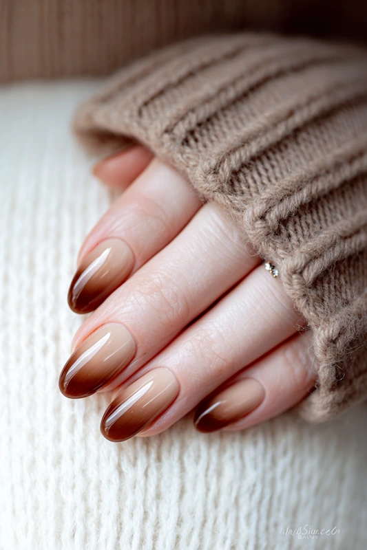 Glossy ombré almond nails fading from sheer nude to rich chocolate brown, cozy and elegant for a chic autumn or winter bridal look Glossy ombré almond nails fading from sheer nude to rich chocolate brown, cozy and elegant for a chic autumn or winter bridal look