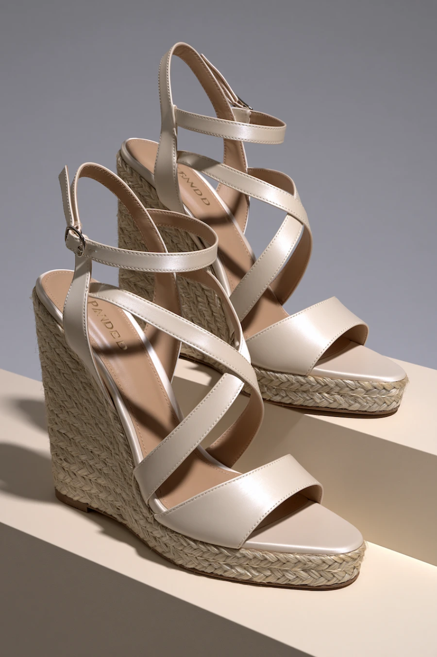Wedding Shoes for the Bride: 27 Beautiful Ideas That Balance Style and Comfort 12 Ivory bridal wedge sandals with braided espadrille heels, crossover straps, and ankle buckles in a clean studio setting