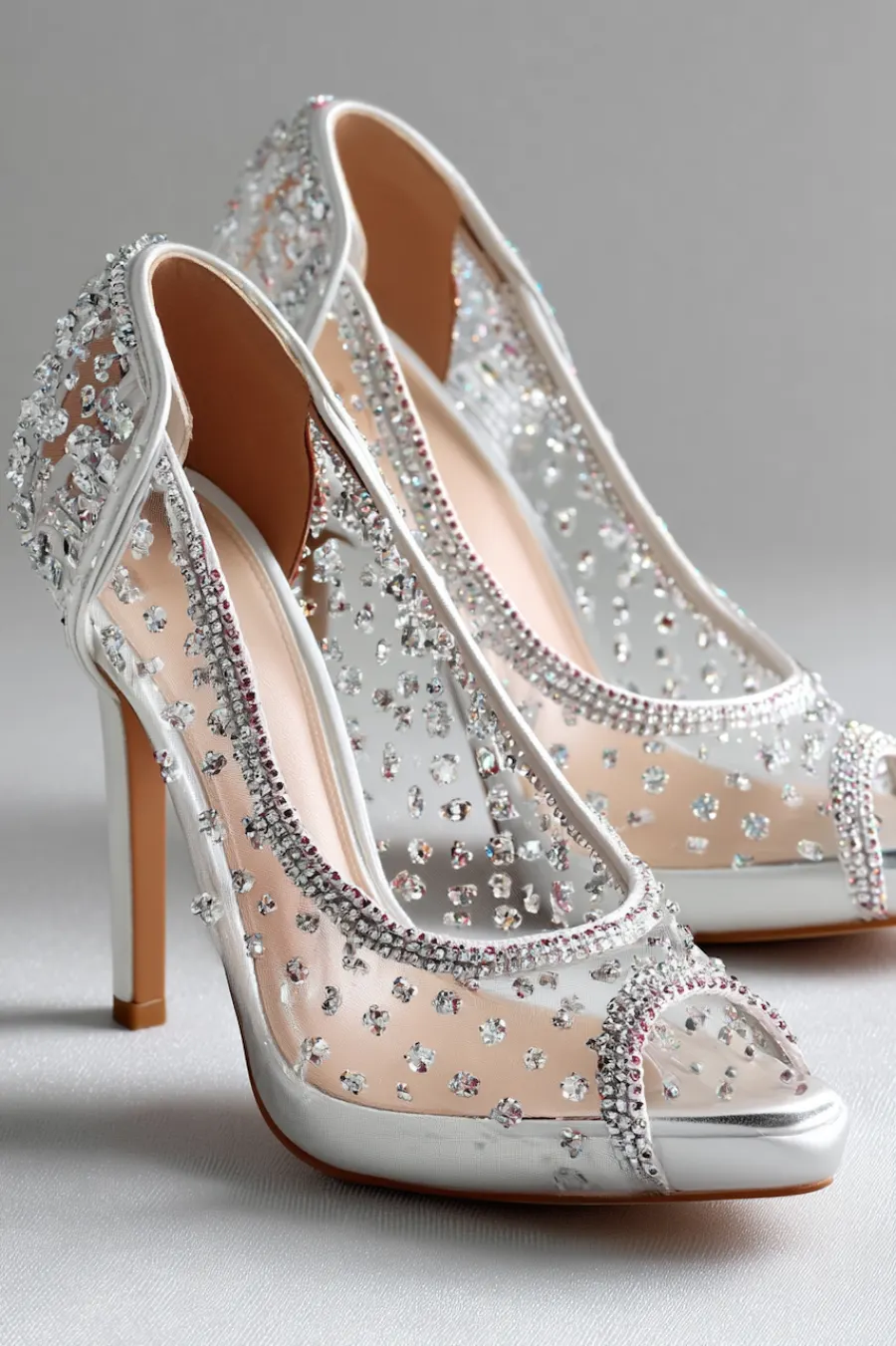 Wedding Shoes for the Bride: 27 Beautiful Ideas That Balance Style and Comfort 25 Ivory crystal embellished wedding heels with sheer mesh panels, peep toes, and sparkling rhinestones for glamorous bridal style